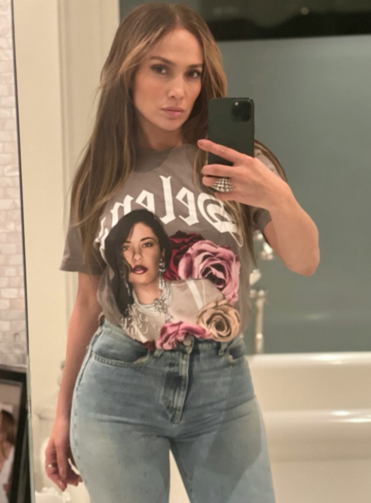 Jennifer Lopez sports a Selena Quintanilla T-shirt. Photo via On The JLo Newsletter/Jennifer Lopez