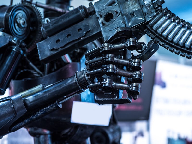 Robot hand holding a gun