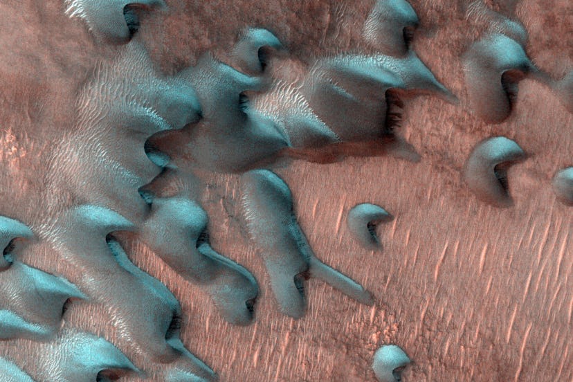 The HiRISE camera aboard NASA’s Mars Reconnaissance Orbiter captured these images of sand dunes cove...