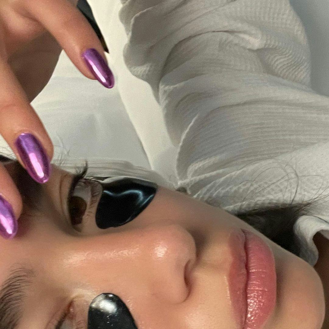 Dua Lipa rocking purple chrome nails.