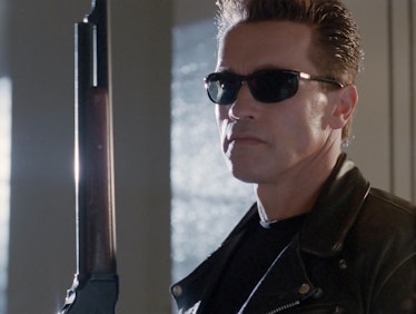 Terminator holding up a gun