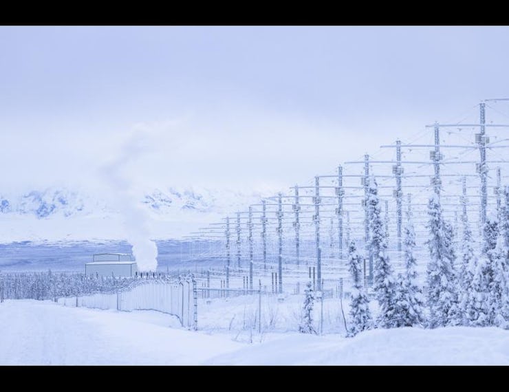 A wintery landscape, where the HAARP facility is blanketed with snow. 
