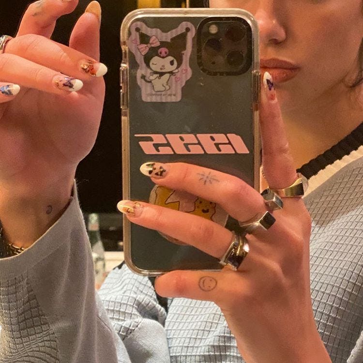 Butterfly nails on Dua Lipa.