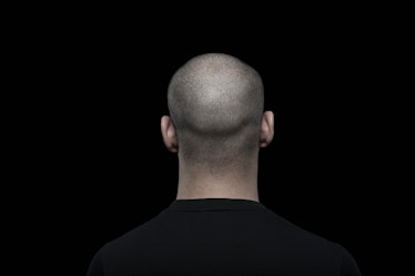 Man with buzzcut photographed from behind