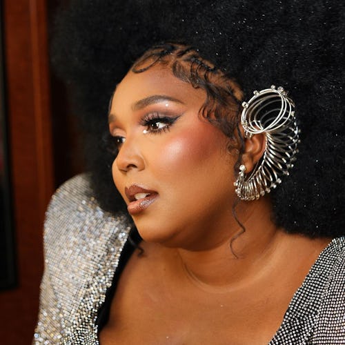 Lizzo with Afro, ear cuff, and rosy blush