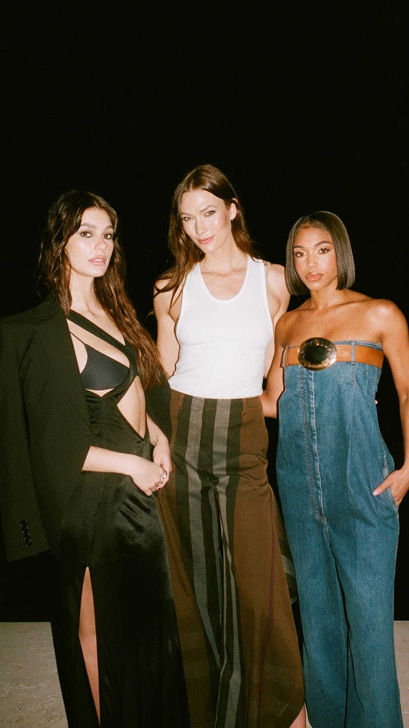 Camila Morrone, Karlie Kloss, and Lori Harvey smizing at the camera