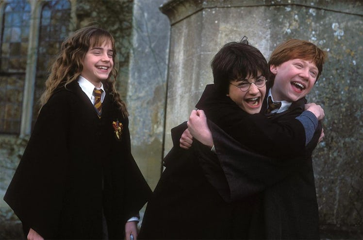 Harry Potter kids laughing, no doubt at one of these Harry Potter jokes.
