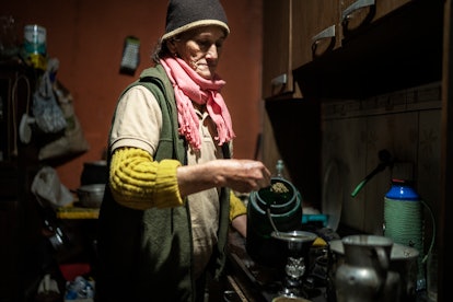 Zulma Chávez Bustamante prepares yerba mate in her home.