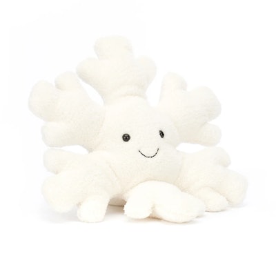 A white snowflake plush with smiling face, one of the cutest new holiday Jellycat plushes 2022