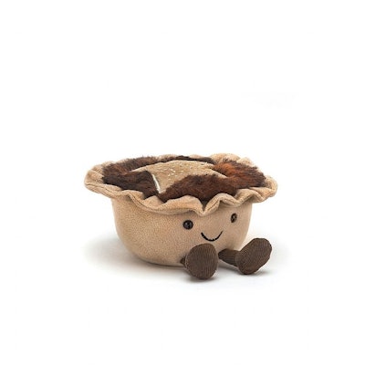 A mince pie plush with a smiling face and tiny feet, from the Jellycat holiday 2022 collection