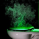 An image of a laser trained on a flushing toilet.