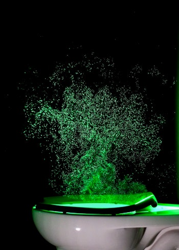 An image of a laser trained on a flushing toilet.