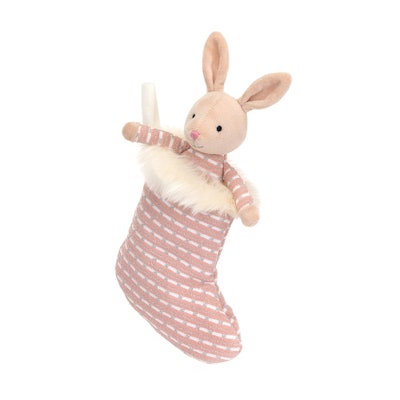 A plush bunny in a pink shimmer stocking