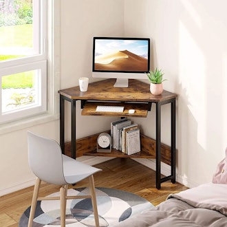This corner desk for small spaces is petite, with a built-in keyboard tray.