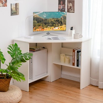This corner desk for small spaces has closed shelves for a streamlined look.