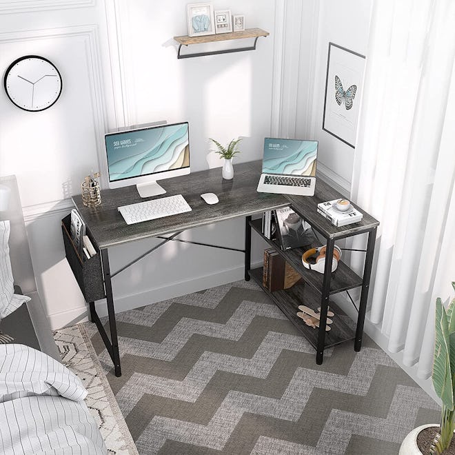 This corner desk for small spaces features multiple shelves and a storage caddy.