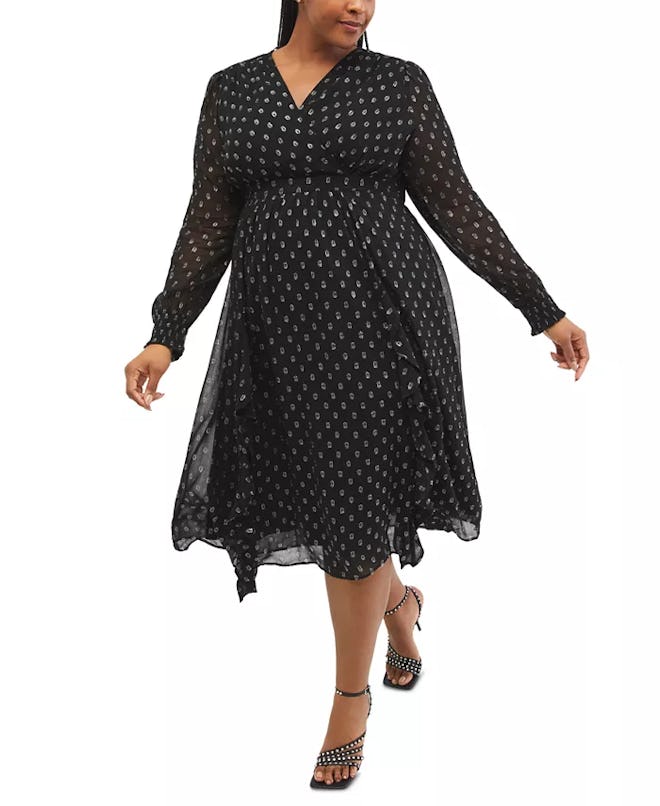 A long-sleeve, midi black wrap dress with silver polka dots