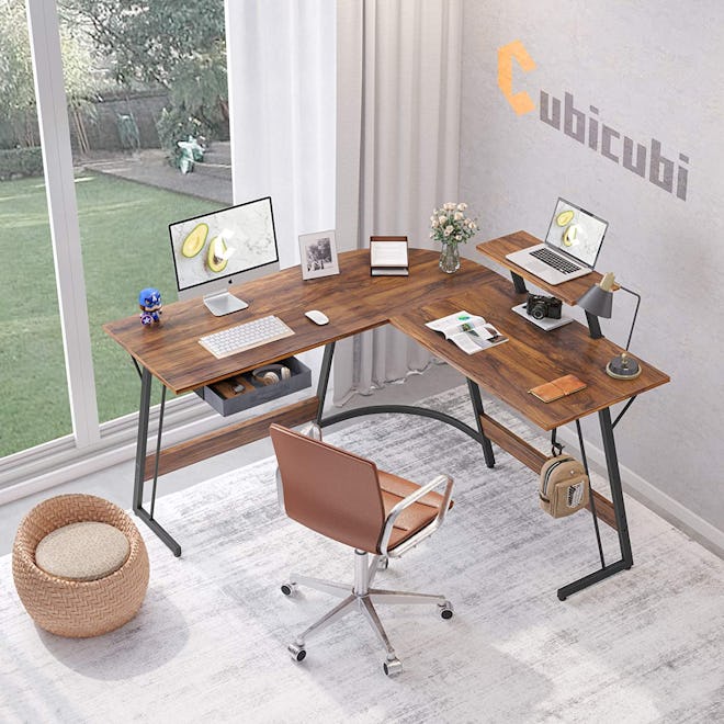 This corner desk for small spaces has a built-in monitor stand.