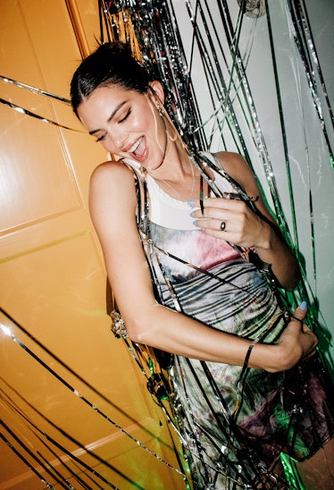 Kendall Jenner is having a good time dancing.