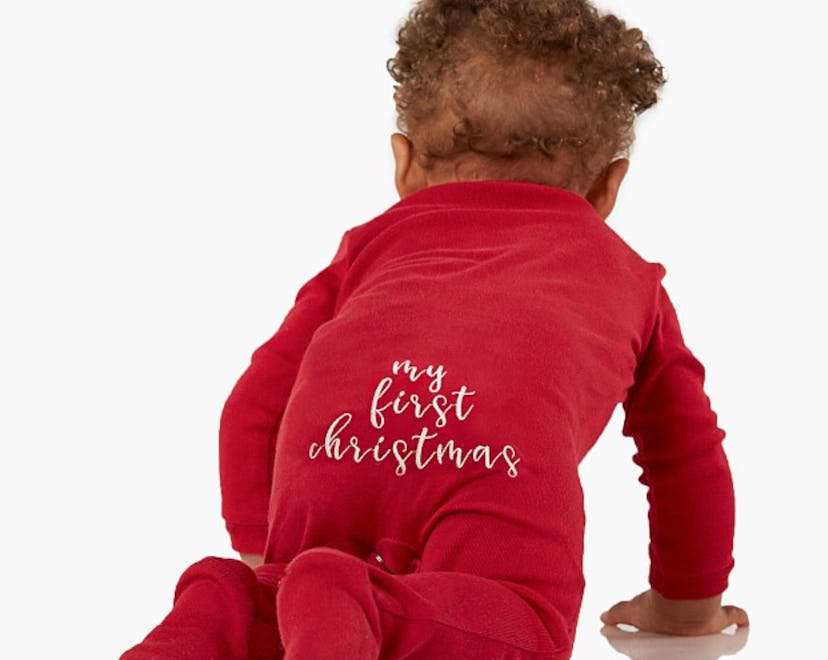 baby crawling in red onesie that is their baby's first Christmas outfit