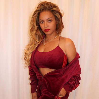 Beyoncé on Valentine's Day with red lipstick and a red Ivy park tracksuit