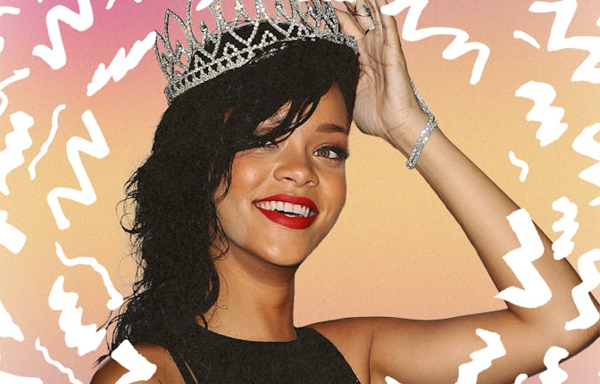 Rihanna in a black dress, smiling as she holds a tiara on her head 