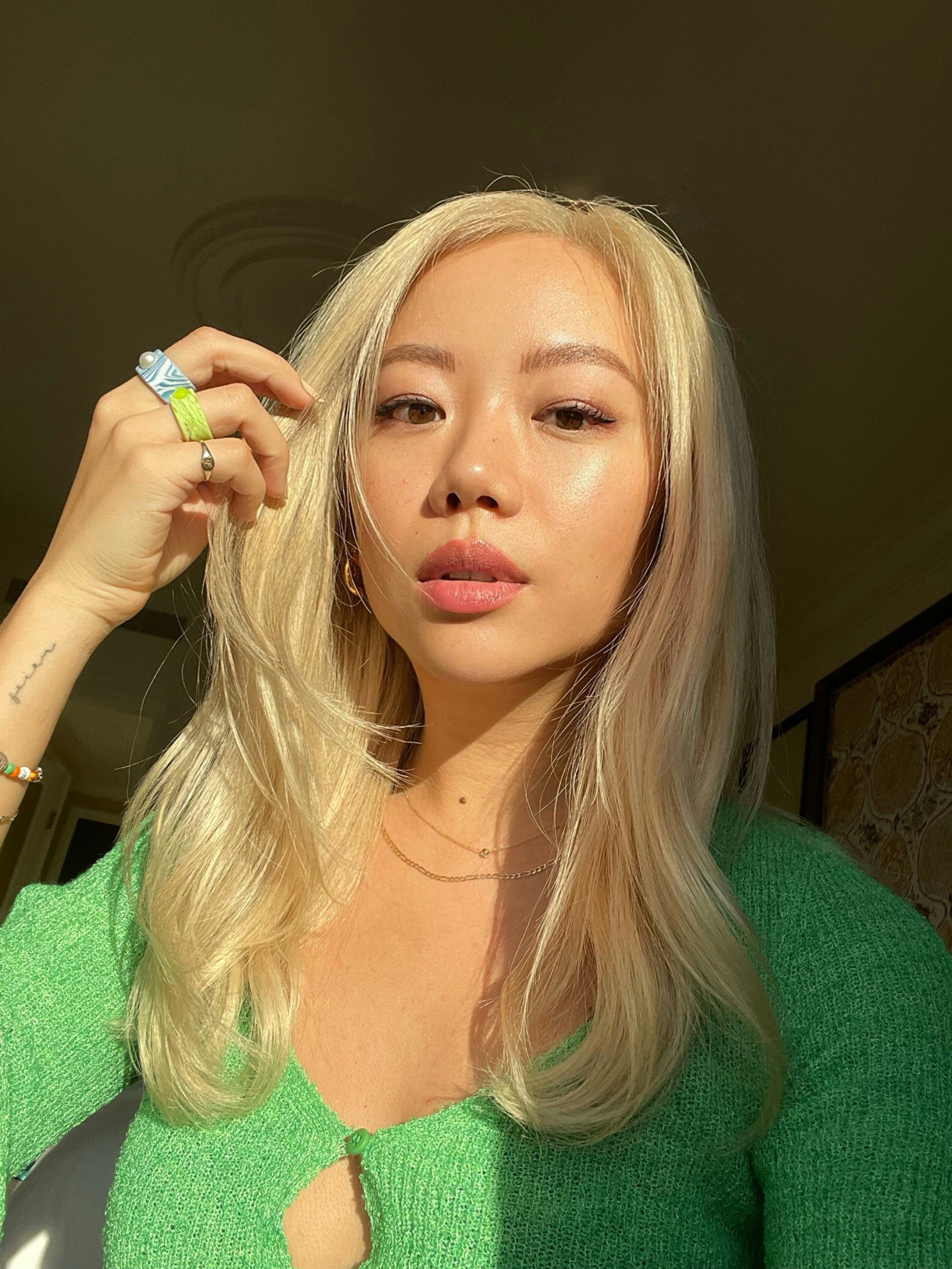 Blonde woman after trying Oribe Hair Alchemy Collection