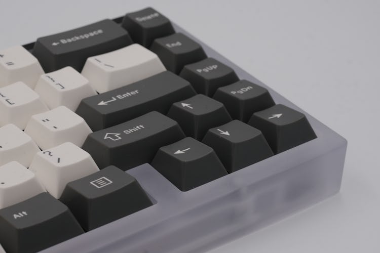 The keyboard uses a traditional 65% layout.