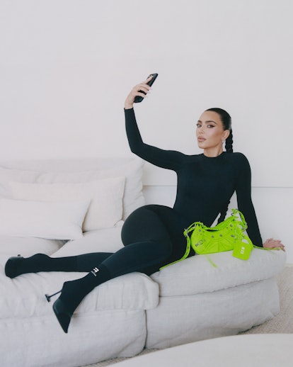 Kim Kardashian taking a selfie in her Balenciaga campaign