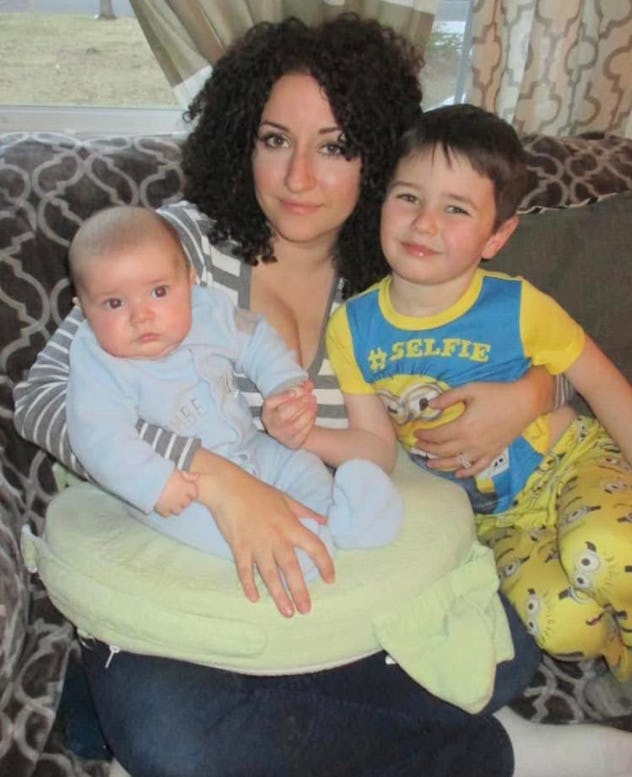 Meredith and her two sons sit on the couch