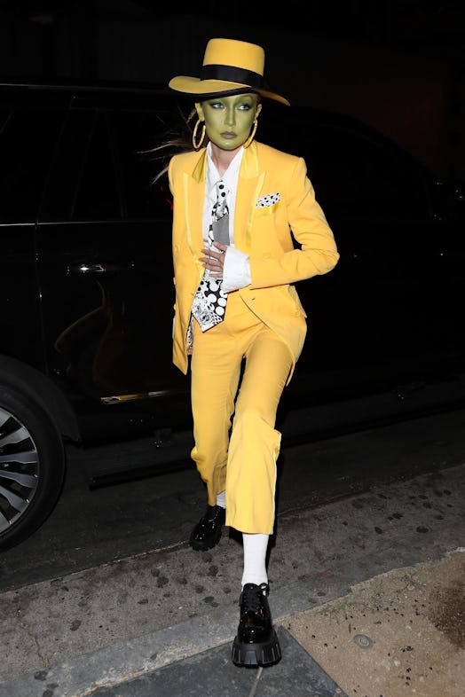 Gigi Hadid wears Iceberg Spring/Summer 2020 yellow blazer and pants.