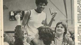 A segment of an old newspaper page with 'The Queen of Basketball' Lucy Harris talking to a group of ...