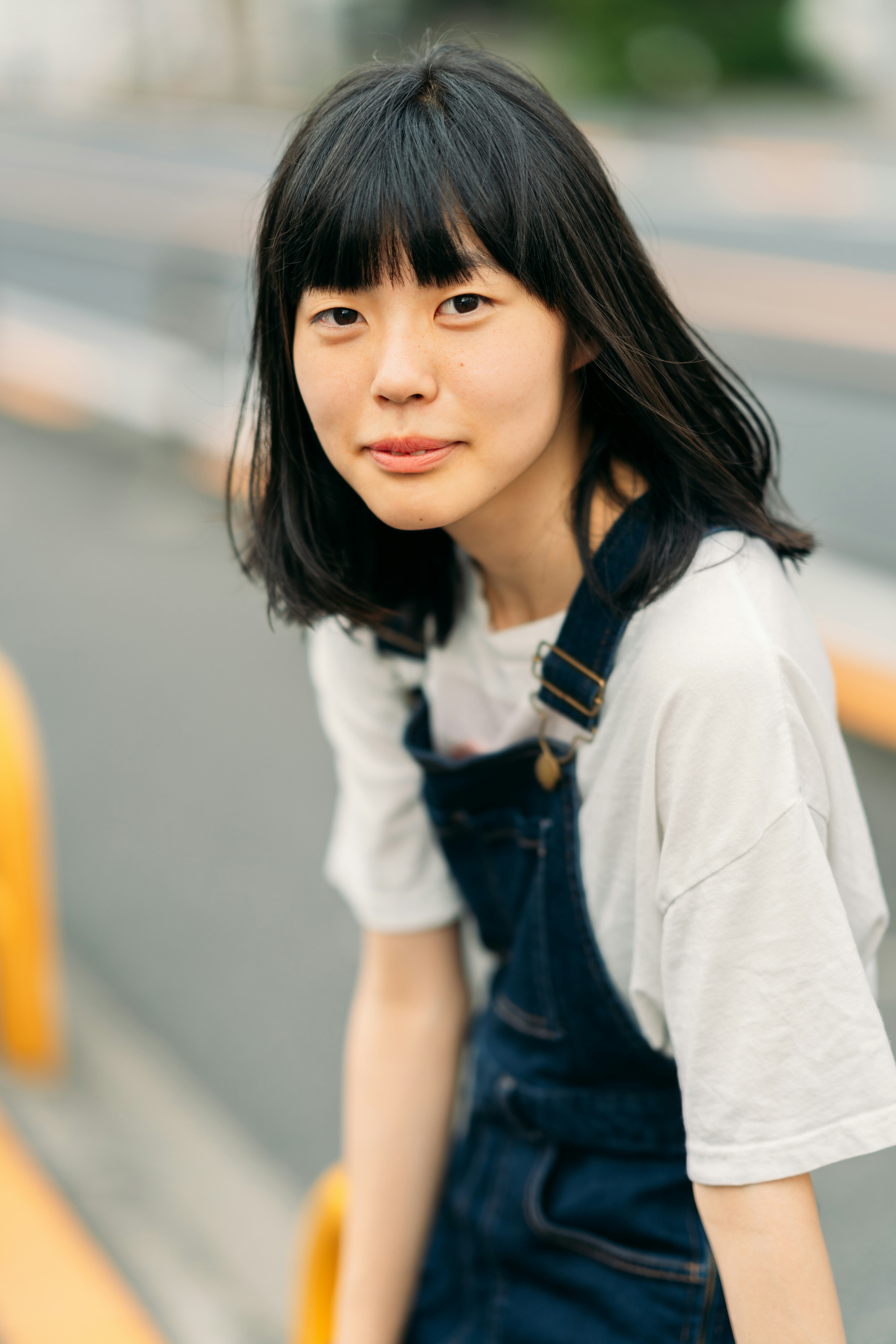 Young woman in overalls having the best day of the month on March 5, 2022, per her zodiac sign.