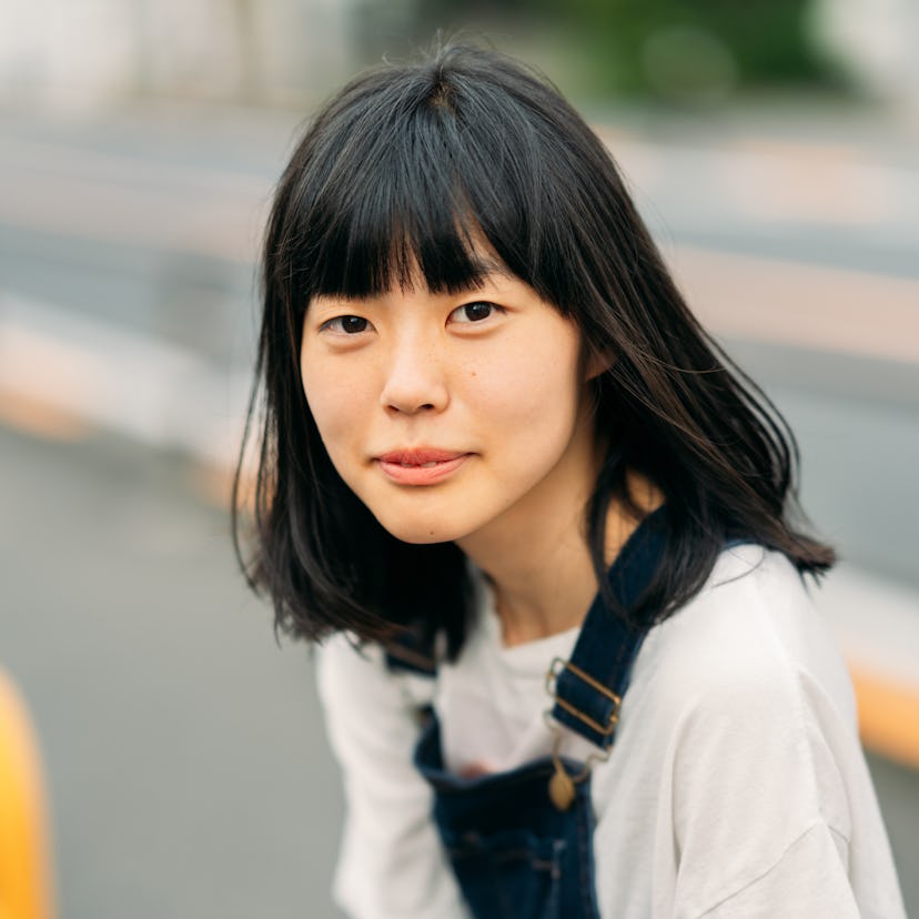 Young woman in overalls having the best day of the month on March 5, 2022, per her zodiac sign.