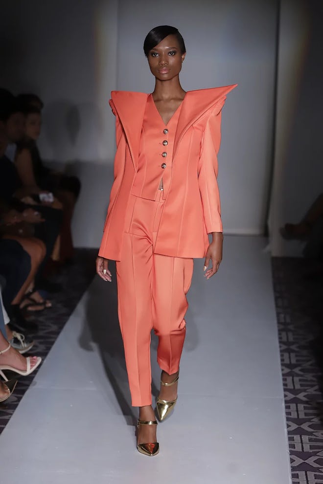Jovana Louis orange suit set.