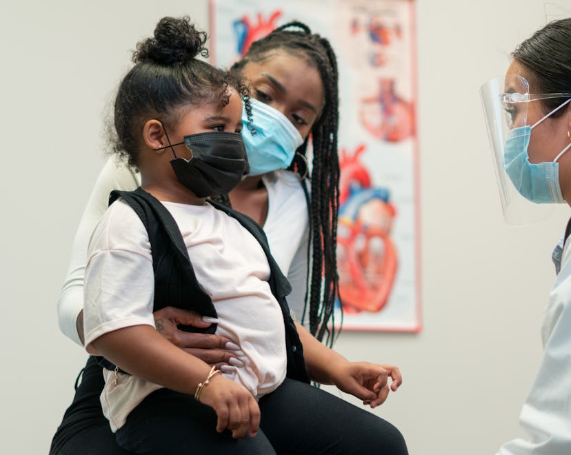 Masked little girl visits doctor during the Covid-19 Pandemic