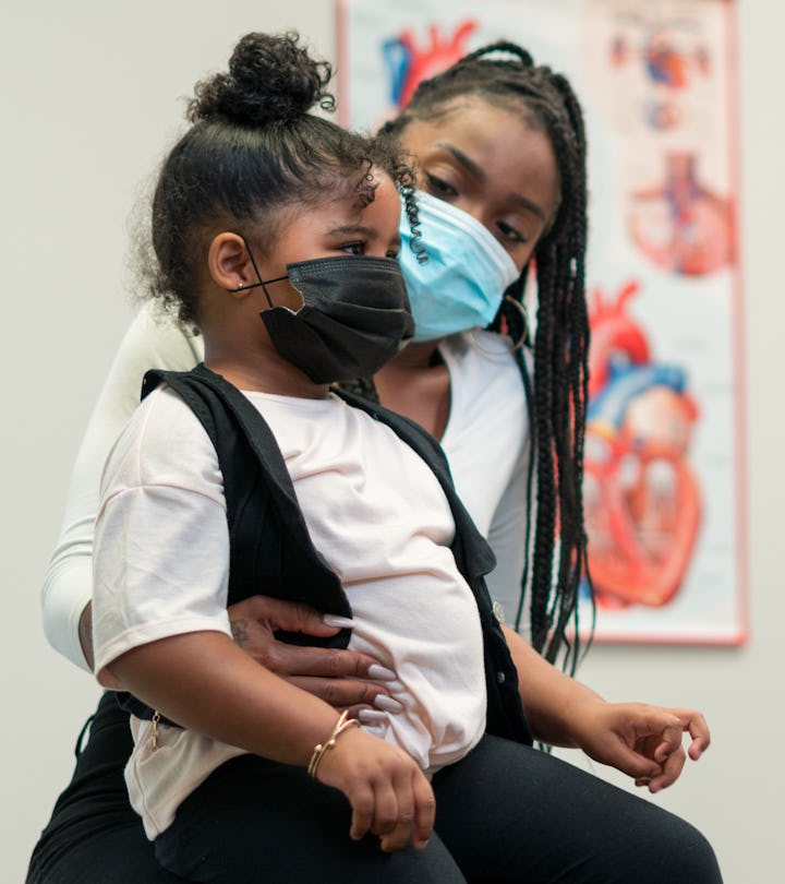 Masked little girl visits doctor during the Covid-19 Pandemic