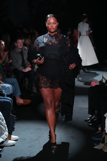 Model on the NY Fashion Week Fall 2022 runway in Brandon Maxwell black lace dress