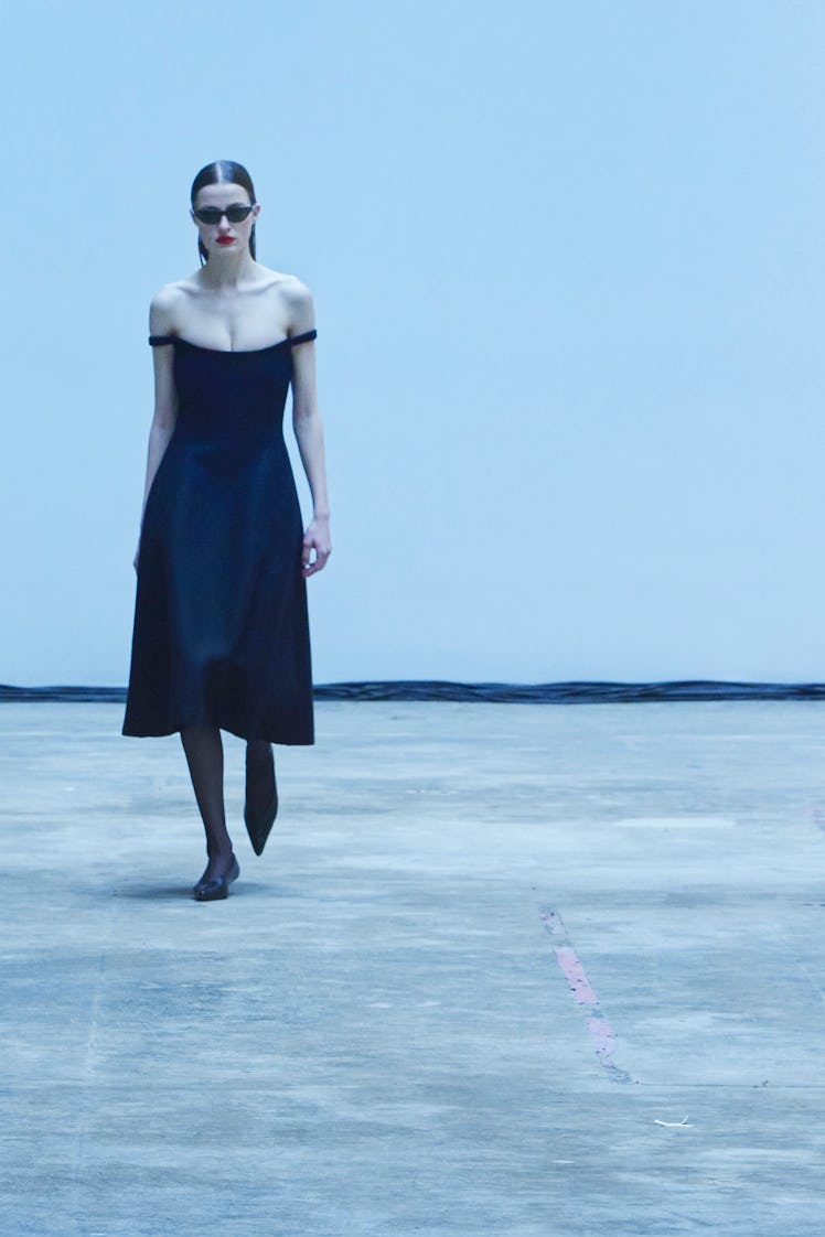 Model on the NY Fashion Week Fall 2022 runway in a Khaite black dress