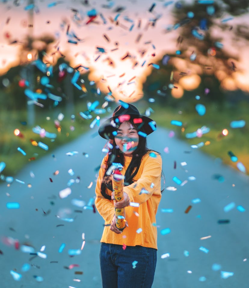 Young woman celebrating February 22, 2022, which is considered lucky in certain countries and in ast...