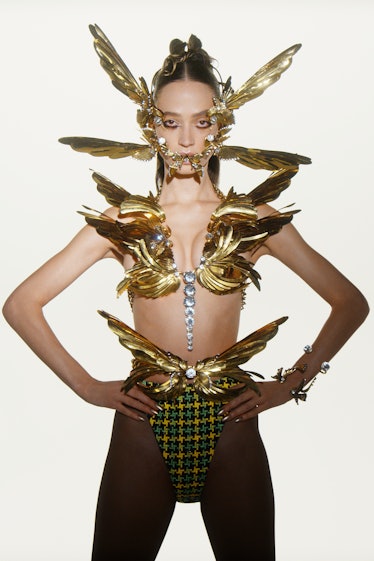 Model in gold look from Area spring 2022