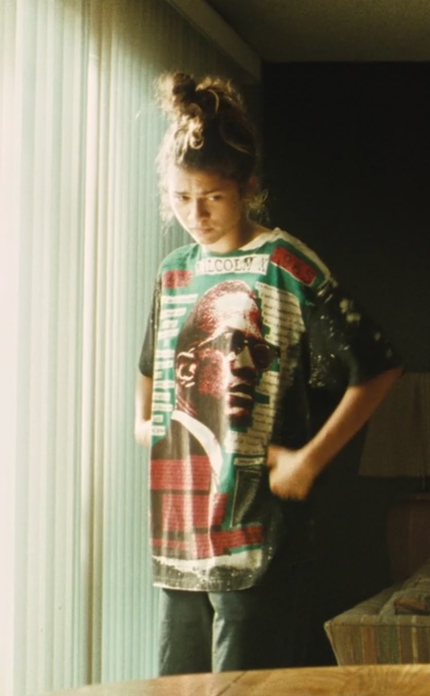  Zendaya as Rue in Euphoria standing in the living room. 