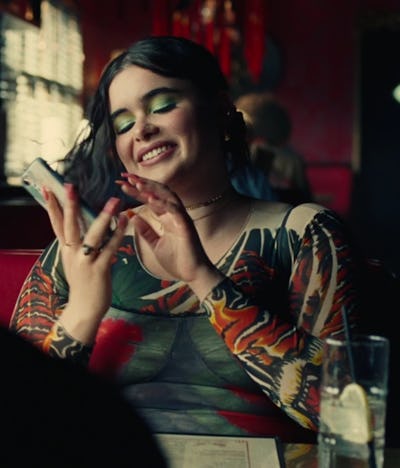 Kat wearing a shirt with psychedelic print and bright makeup in "Euphoria" season 2, episode 6.