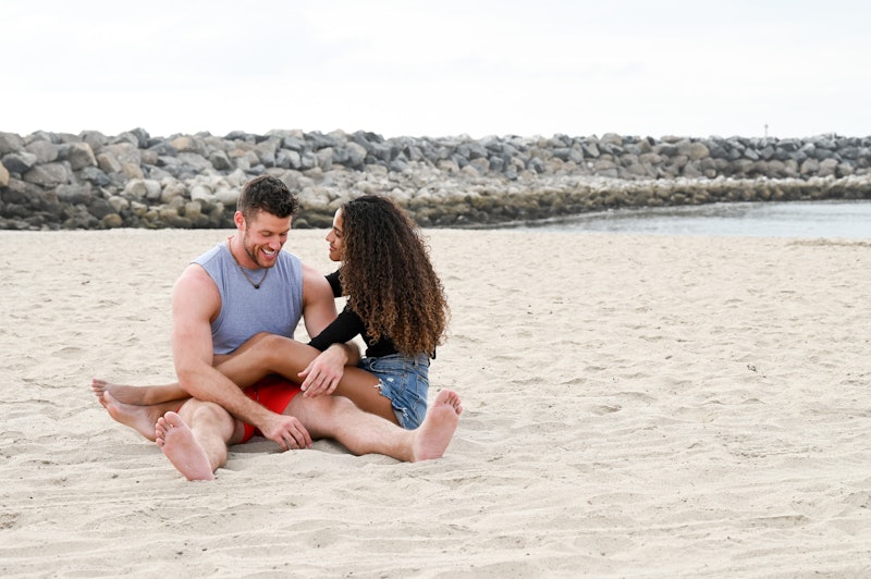 Clayton Echard and Teddi sitting in at the beach on 'The Bachelor'