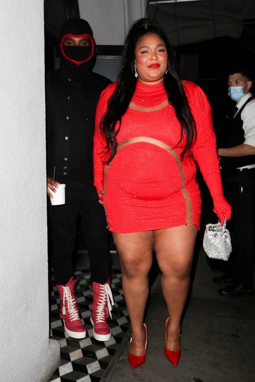 Lizzo wearing a red dress. 
