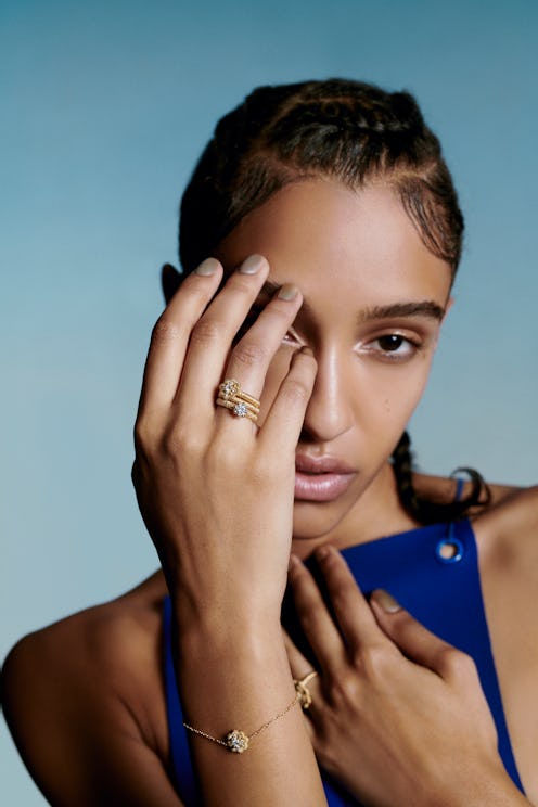 Model posing while wearing French Heritage Jewelry Brand Oscar Massin