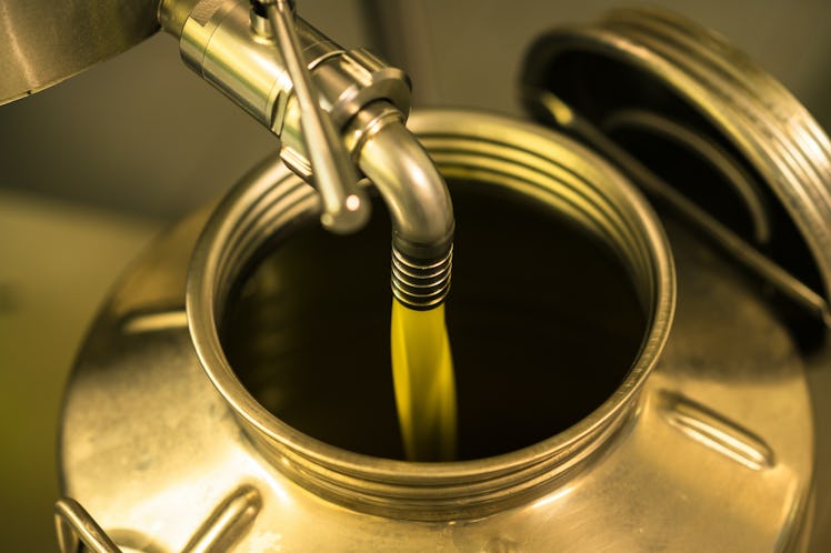 olive oil coming out of a tap
