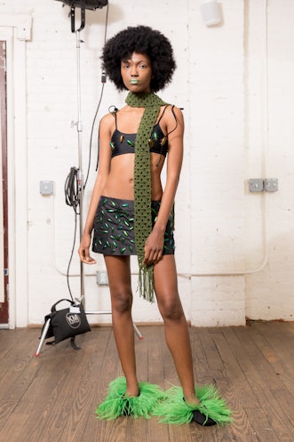 A model wearing a green piece from Dauphinette's Fall 2022 collection.