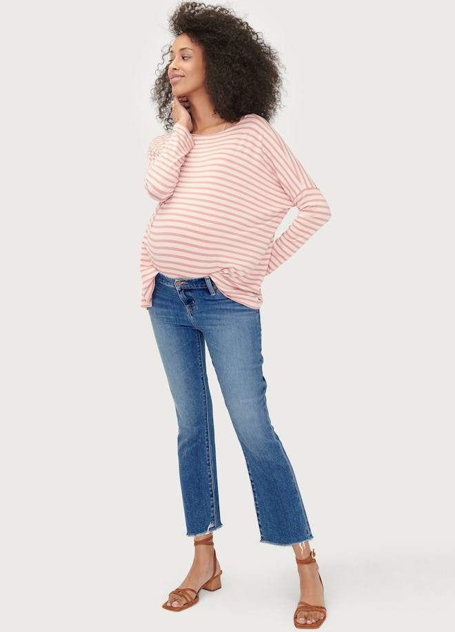 Pregnant woman modeling crop jeans