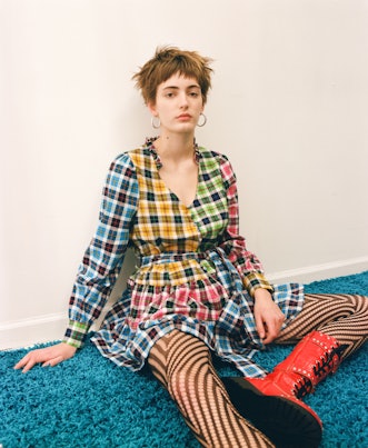 Model wearing a designer Colin Locascio's checkered blue, yellow, red and green dress